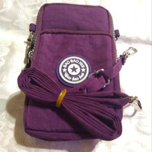 PURPLE PURSE/CARRY ALL., PHONE, STRONG WRISTBAND, ZIPPERED POCKETS/ STRAP. 7"